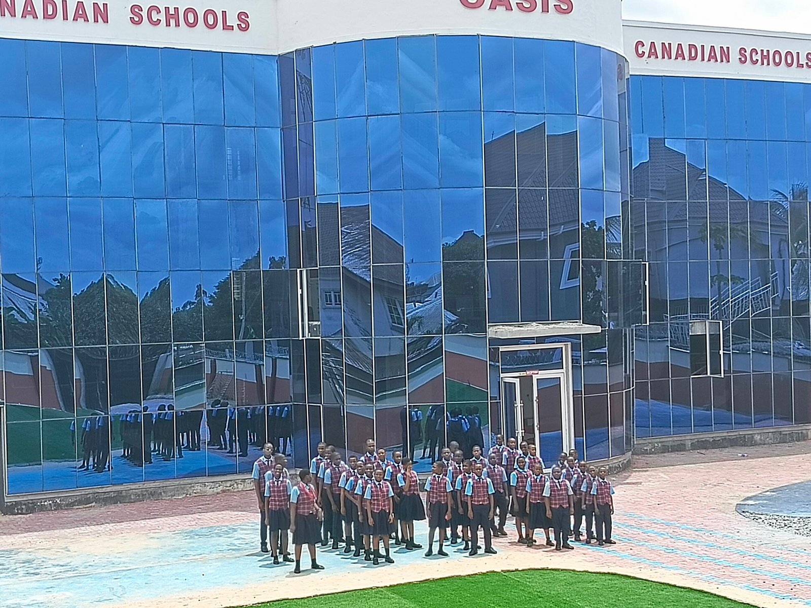 Students outside Oasis Canadian Schools campus in Port Harcourt during admissions