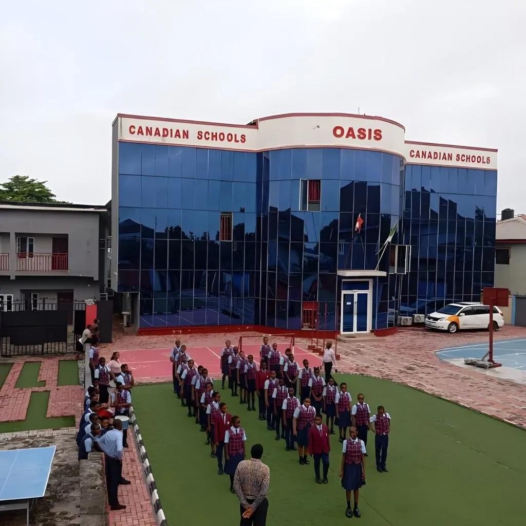 Oasis Canadian Schools students at morning assembly in front of the school building, Port Harcourt